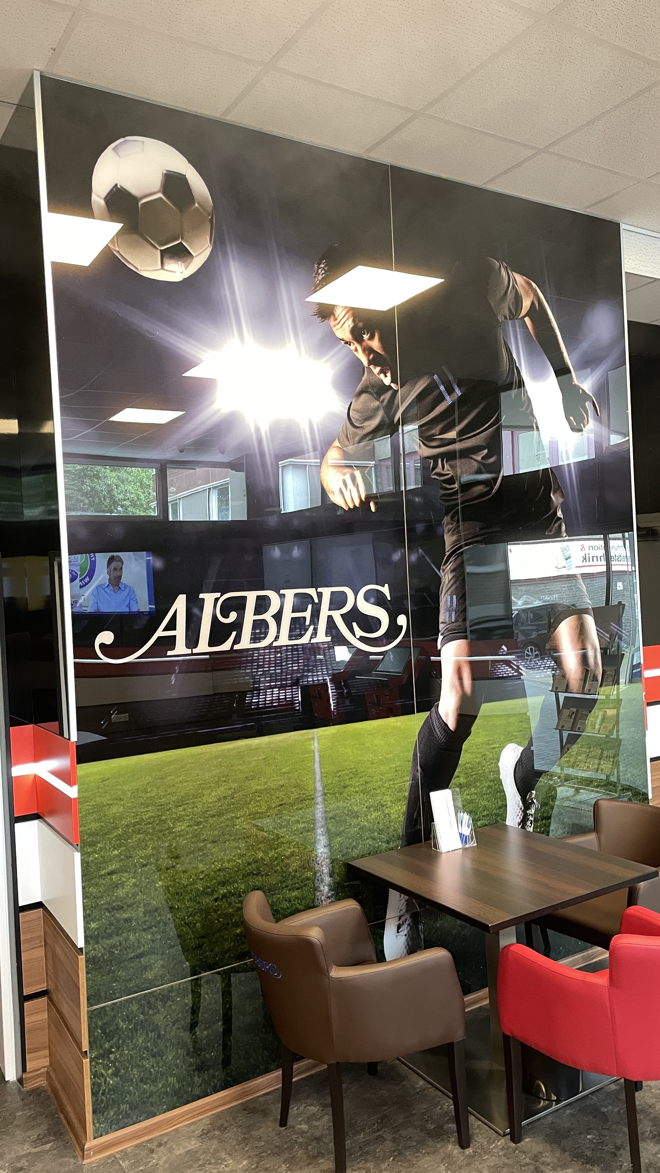 Wandbild Fußballspieler mit Albers Logo